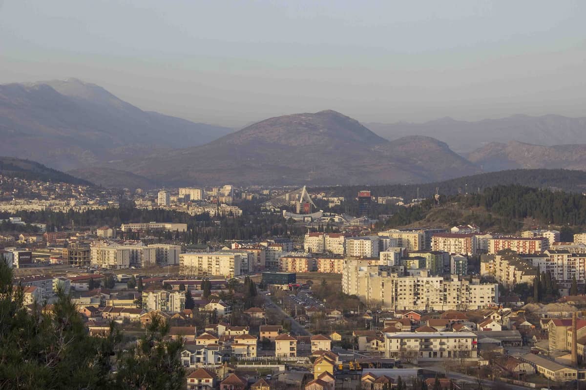 The view of Podgorica, from Cetinje road, with buildings and many bridges visible.